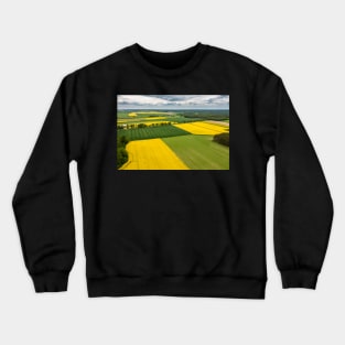 Agricultural landscape, fields of yellow colza and green grain Crewneck Sweatshirt